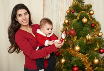 happy family portrait in christmas decoration, winter holiday concept, decorated fir tree and gifts