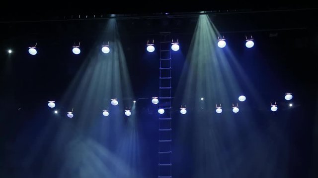 Theatrical equipment on stage: spotlights, scanners, head, smoke, special effects