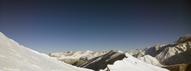 Aerial Views of an Alpine Valley and High Mountains covered in Fresh Snow © neil
