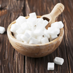 White sugar on the wooden table
