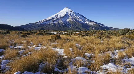 Deurstickers Mount Taranaki covered in snow on the north island of New Zealand. © wetraveltolive