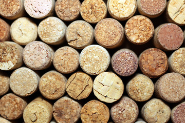 Background of used wine corks. Wall of many different wine corks. Closeup of wine corks.