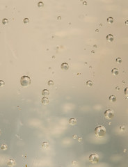 Water bubbles in a glass container close up