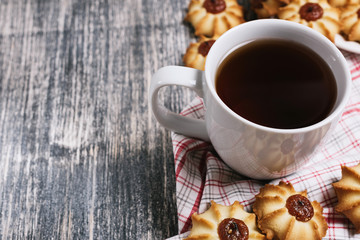 Cup of hot tea with delicious cookies