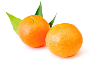 Mandarin, tangerine citrus fruit with leaves isolated on white 