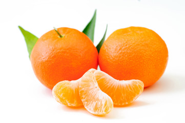 fresh orange fruits with leaf isolated on white