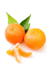 fresh mandarin with leaf and orange slices isolated 