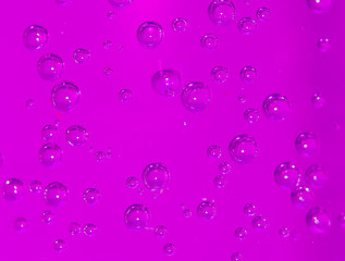 purple bubbles in water close-up abstract background