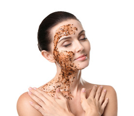 Beautiful young woman with facial scrub mask on white background