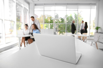 Business training concept. Laptop on white office table