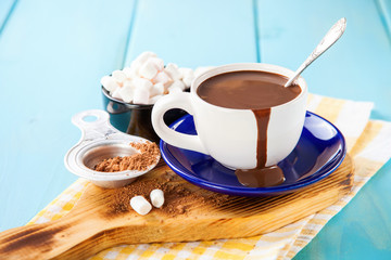 hot chocolate in a cup on a table, selective focus. copy space