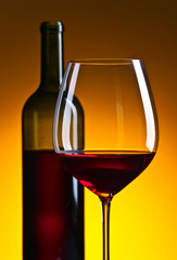 glass and bottle with red  wine