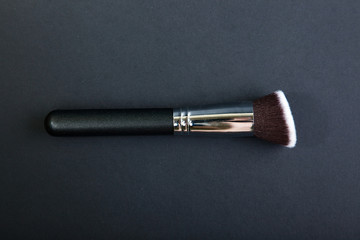 Professional make-up brush on black background, natural cloth, m