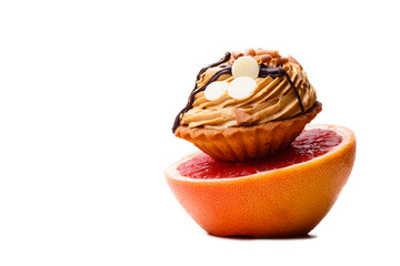 Grapefruit and cake. Dieting concept.