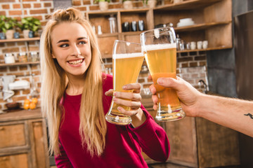 Woman toasting with beer