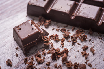 dark chocolate on wood desk