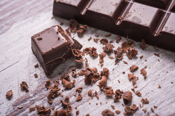 dark chocolate on wood desk