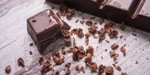 dark chocolate on wood desk
