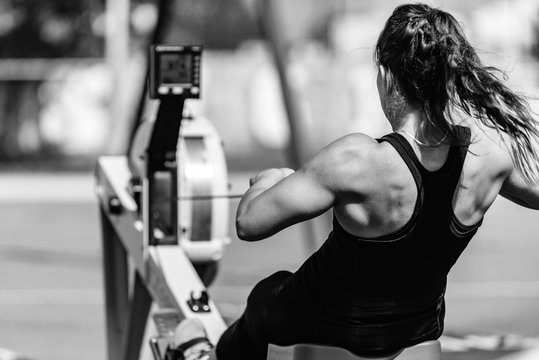 Woman on rowing machine on competition
