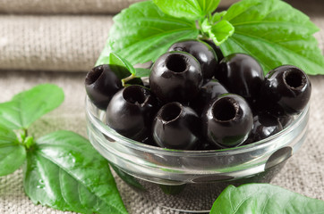 Close-up view of the black olives, pitted marinated