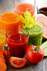 Glasses with fresh organic vegetable and fruit juices