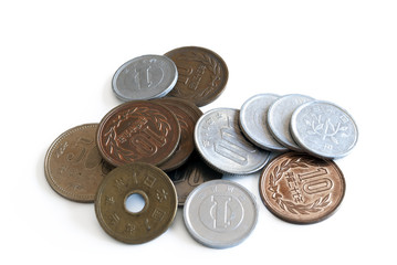 scattered Japanese yen coins isolated on white background
