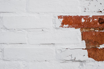 ragged white and red brick wall