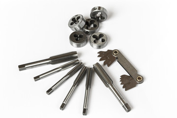Professional mechanical hand tool set . Tap and die nuts for metal processing.