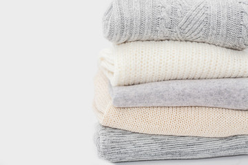 stack of sweaters isolated on white. Close up