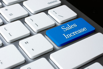 Sales Increase on white keyboard