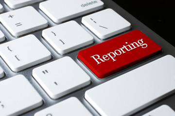 Reporting on Red Enter Button on white keyboard