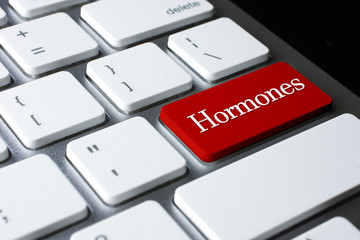 Hormones on Red Enter Button on white keyboard