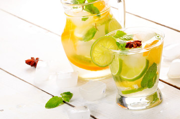 Jug with Lime and Orange Fruit Water with ice