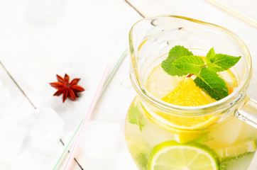 Jug with Lime and Orange Fruit Water with ice