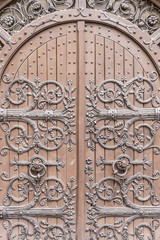 Closeup of old arched wooden door of a churcc