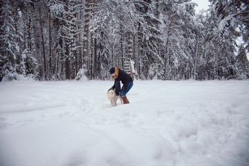 walks outdoors: the girl embraces a dog