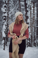 girl walks on the winter forest