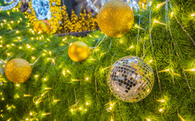 Mirror balls for Christmas and new year day decorate on green grass.