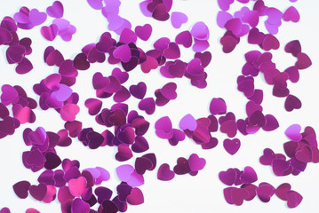 Confetti hearts on a white background,