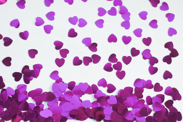 Confetti hearts on a white background,