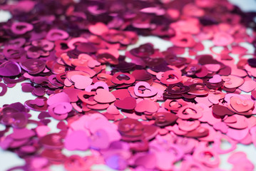 Confetti in the shape of hearts scattered on the table.