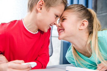 Smiling schoolchildren playing together