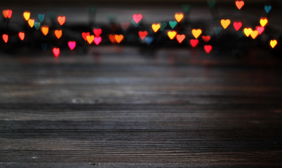 Heart bokeh, Valentine's day concept on wooden background