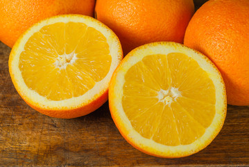 Oranges Fruits and Orange Slice on Wooden Table and Retro Fabric