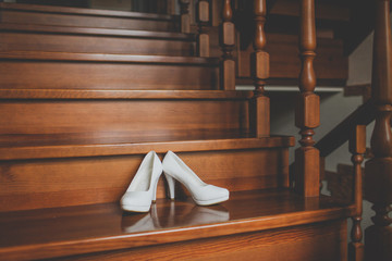 Wedding shoes white color on the stairs