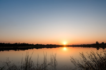 Plakat sunset on the lake landscape