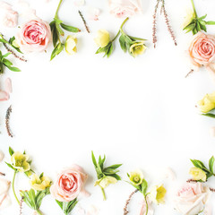 Frame of pink roses, branches, leaves and petals isolated on white background. Flat lay, top view