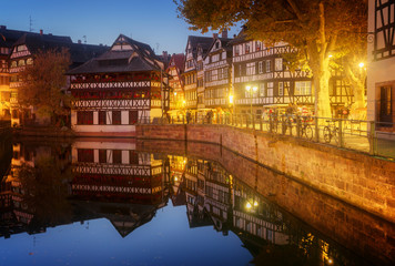 Petit France medieval district of Strasbourg at night, Alsace France, toned