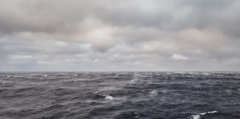 Fototapeta premium Ocean warm water evaporates rapidly when cold dry air blows upon it - rare phenomenon