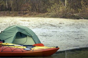Fototapeta premium Camping with kayaks on the river bank.
